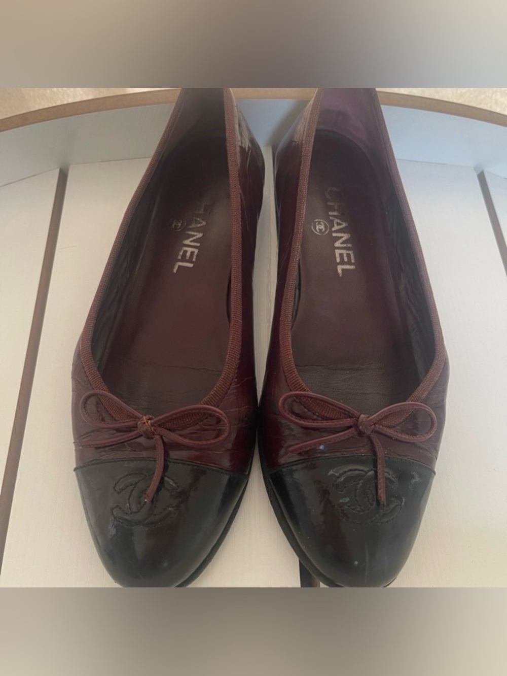 CHANEL Burgundy and Black Leather Cap-Toe Ballet Flats
